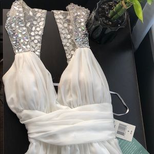 This is a short prom ivory dress size 9 never worn